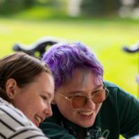 Two students look at items during Student Small Business Market.